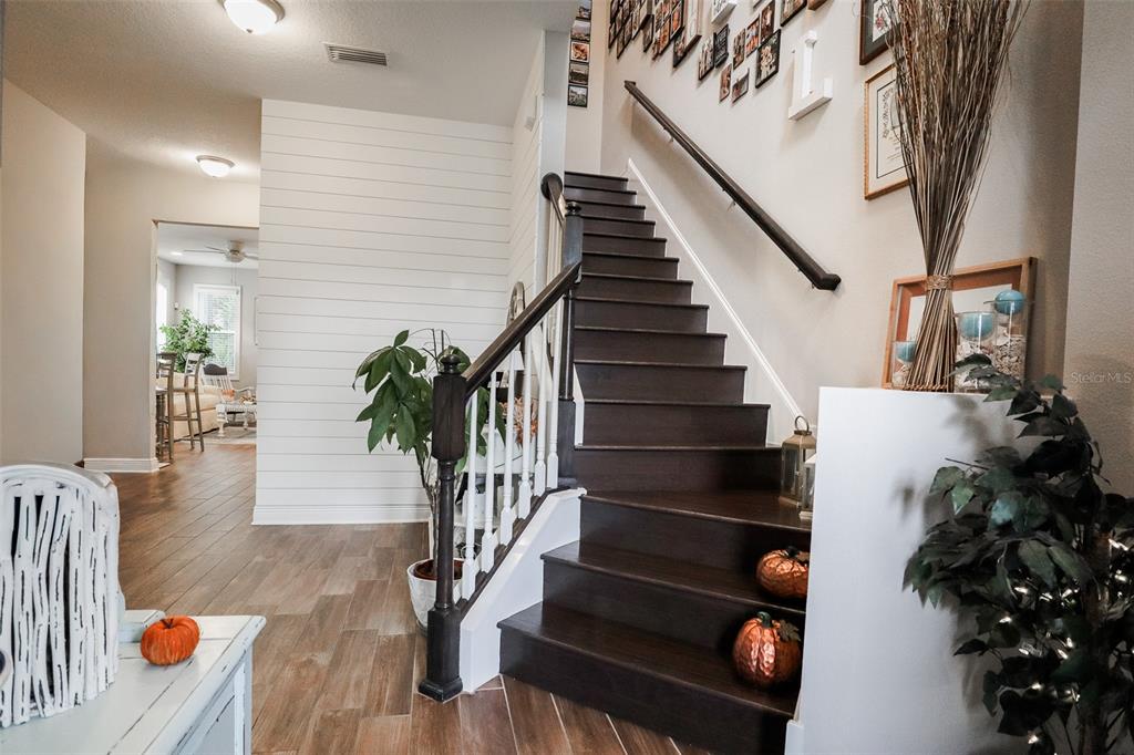 12556 Rangeland Boulevard Odessa, FL 33556 - Photo 6 of 27 a view of entryway and hall with wooden floor