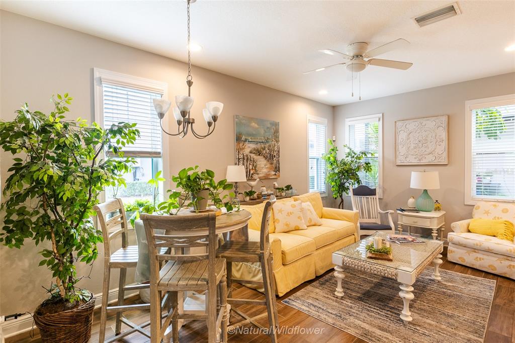12556 Rangeland Boulevard Odessa, FL 33556 - Photo 7 of 29 a living room with patio furniture and a potted plant