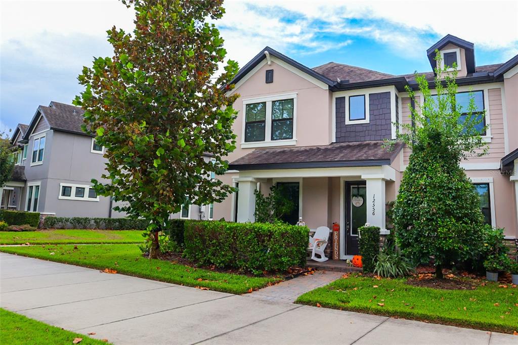 12556 Rangeland Boulevard Odessa, FL 33556 - Photo 8 of 27 a front view of a house with a yard