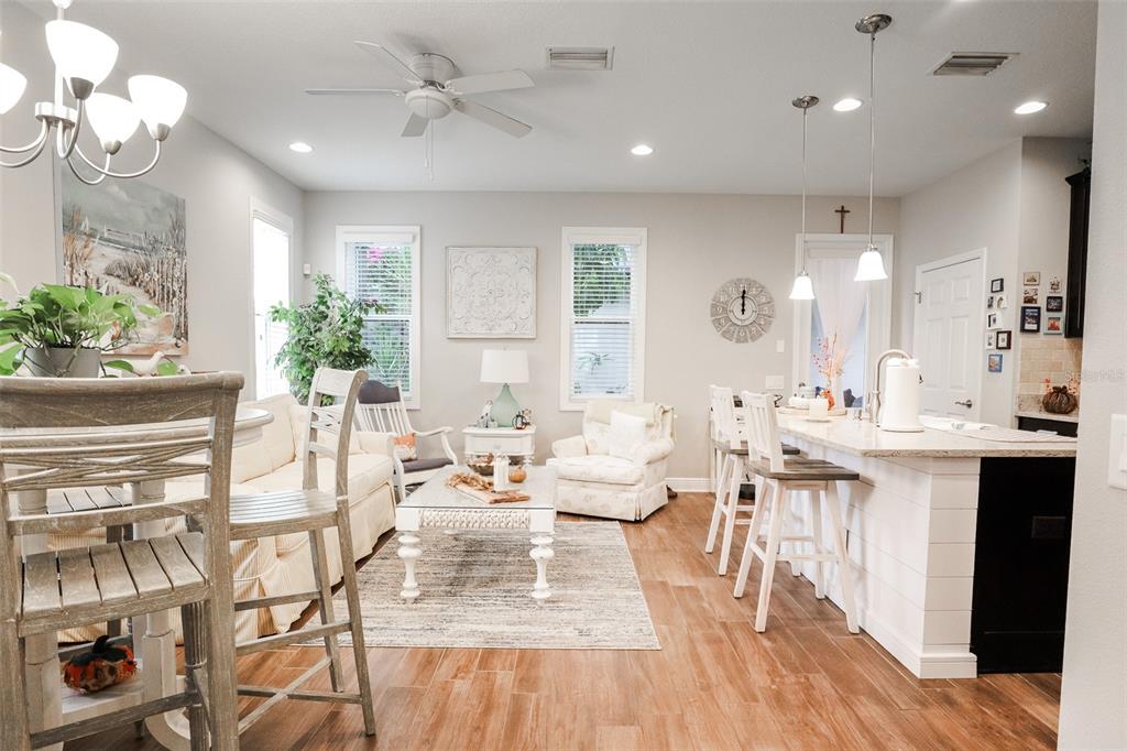 12556 Rangeland Boulevard Odessa, FL 33556 - Photo 9 of 27 a living room with lots of white furniture and wooden floor