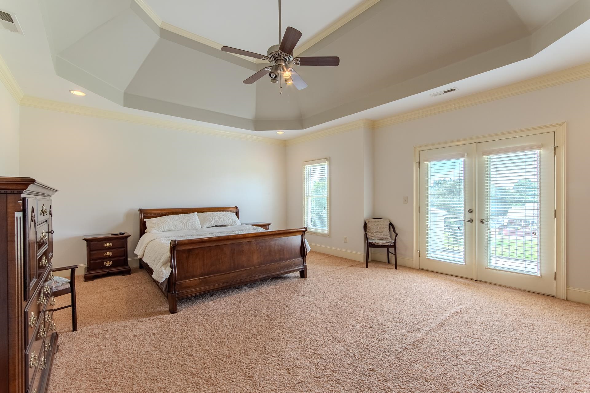 116 Sunset Drive Clifton, TN 38425 - Photo 12 of 40 a bedroom with a bed and large glass window