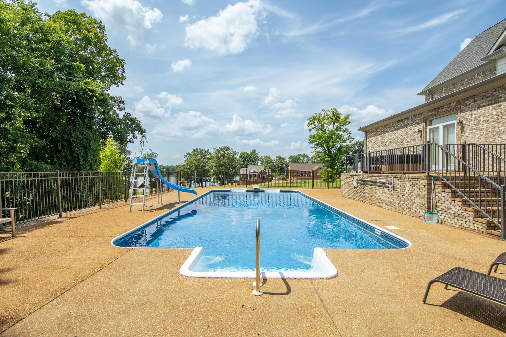 116 Sunset Drive Clifton, TN 38425 - Photo 13 of 40 a view of a swimming pool with a lounge chair