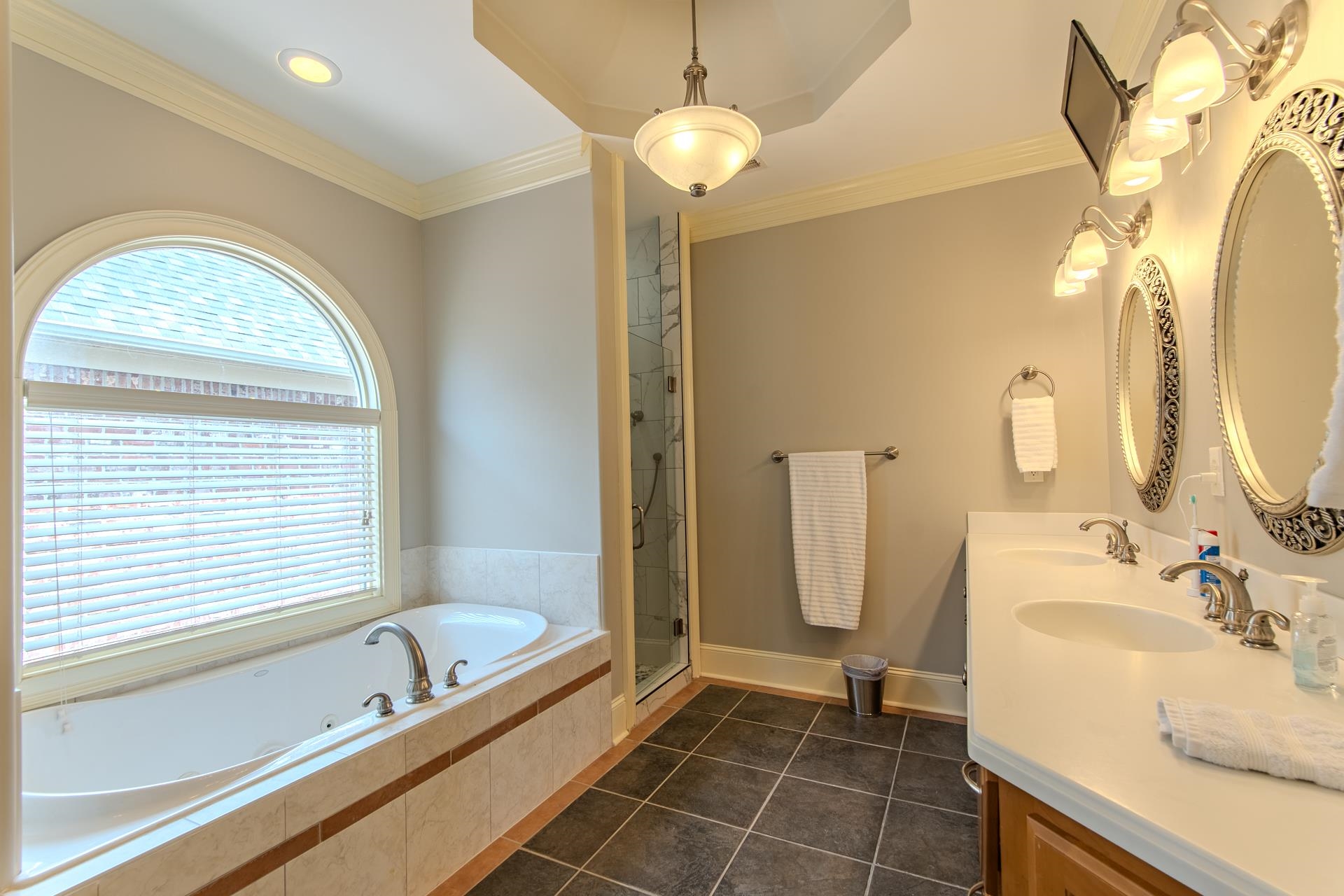 116 Sunset Drive Clifton, TN 38425 - Photo 23 of 40 a bathroom with a granite countertop sink a toilet and shower