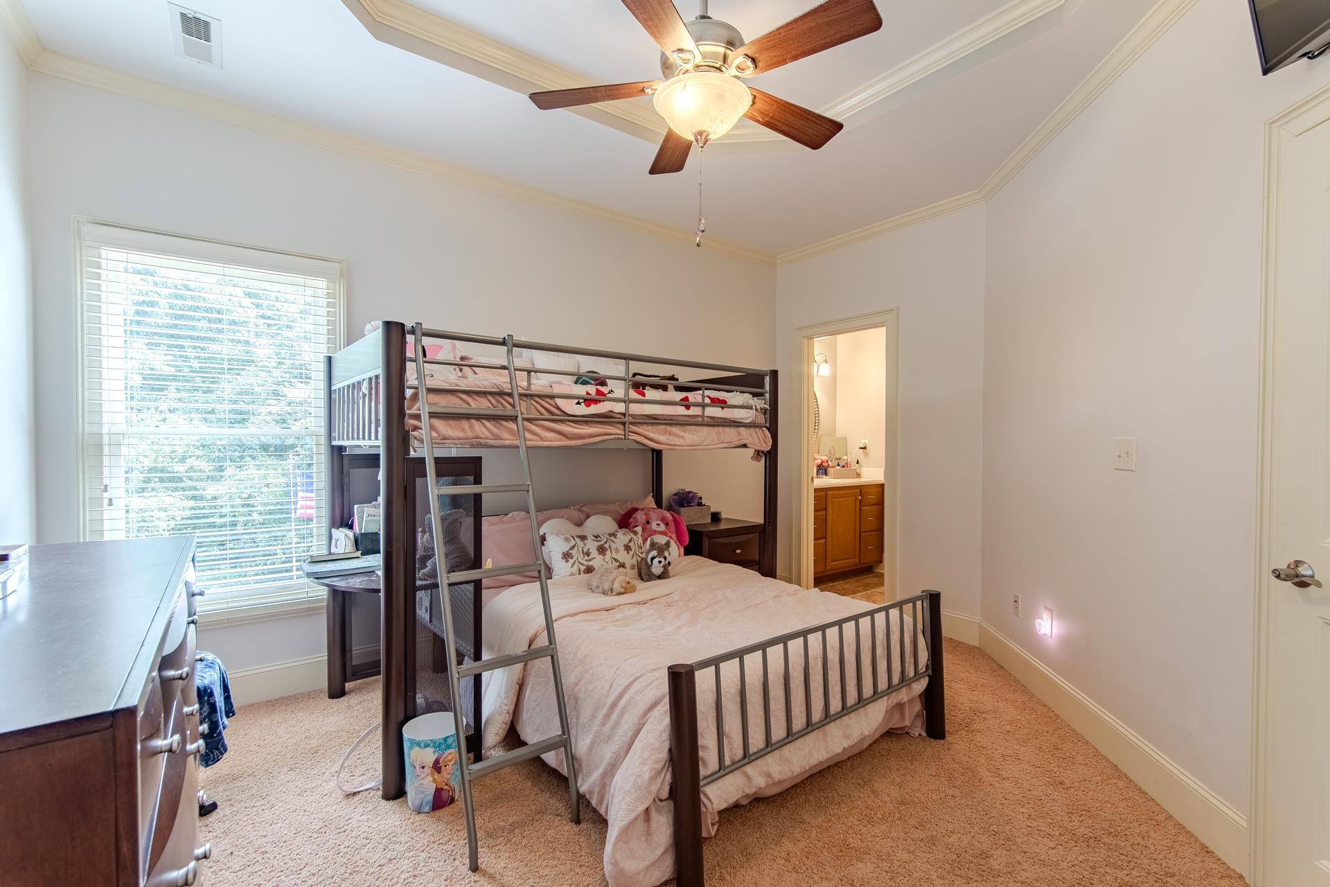 116 Sunset Drive Clifton, TN 38425 - Photo 24 of 40 a bedroom with a bed and a chandelier