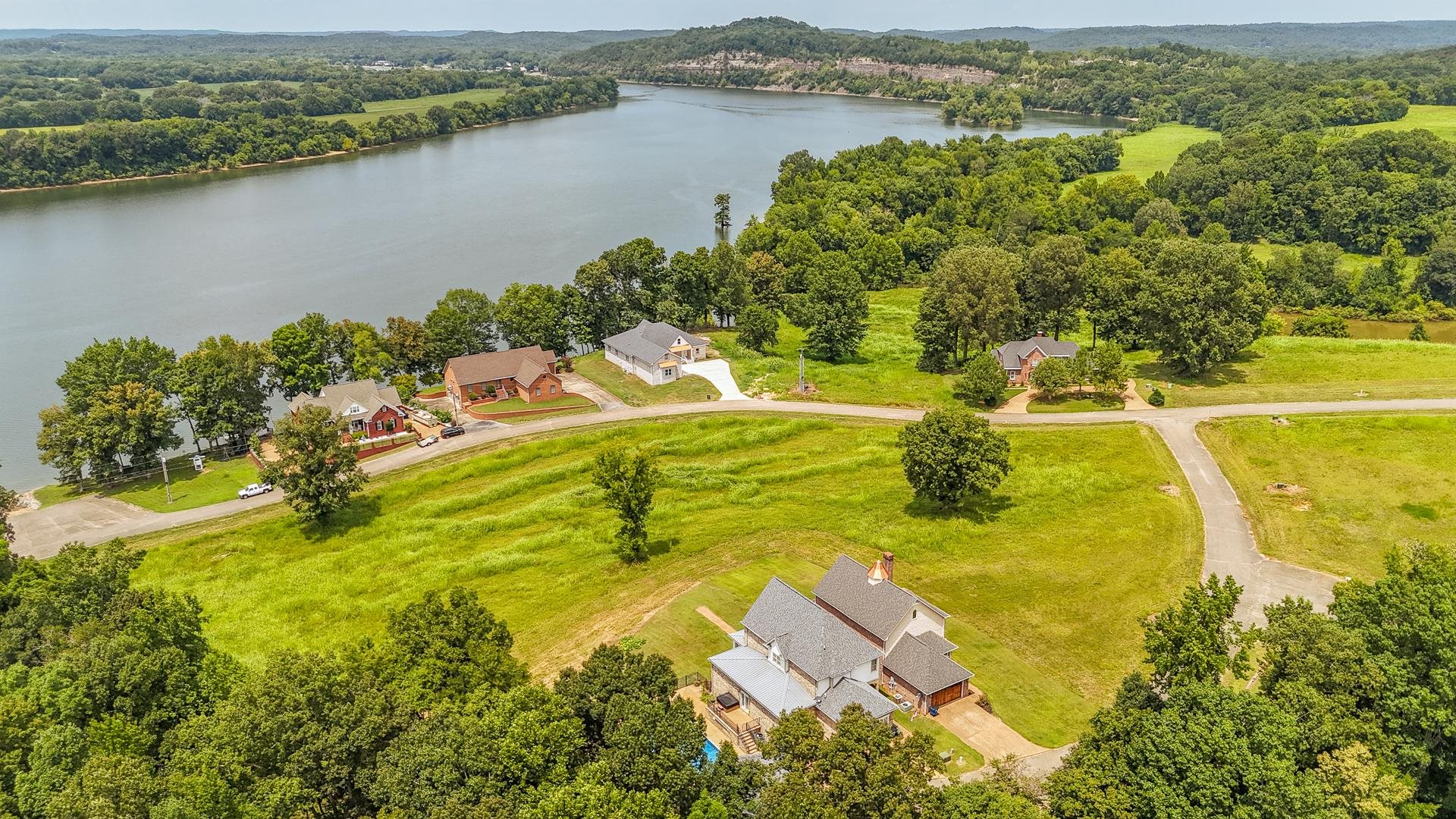 116 Sunset Drive Clifton, TN 38425 - Photo 40 of 40 an aerial view of residential houses with outdoor space and lake view