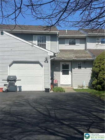 a front view of a house with a garage