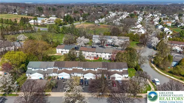 an aerial view of a house with a lake view