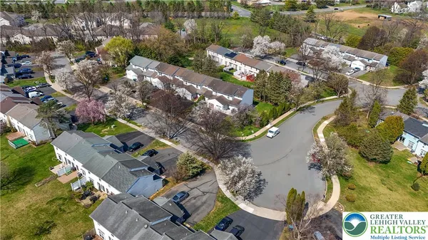 an aerial view of residential house with outdoor space and swimming pool