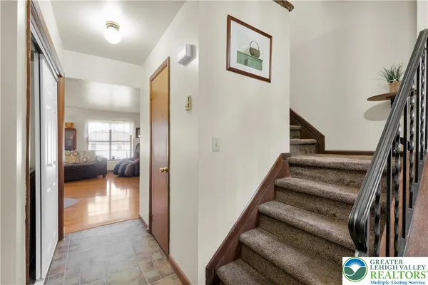 a view of a hallway with a livingroom and a furniture