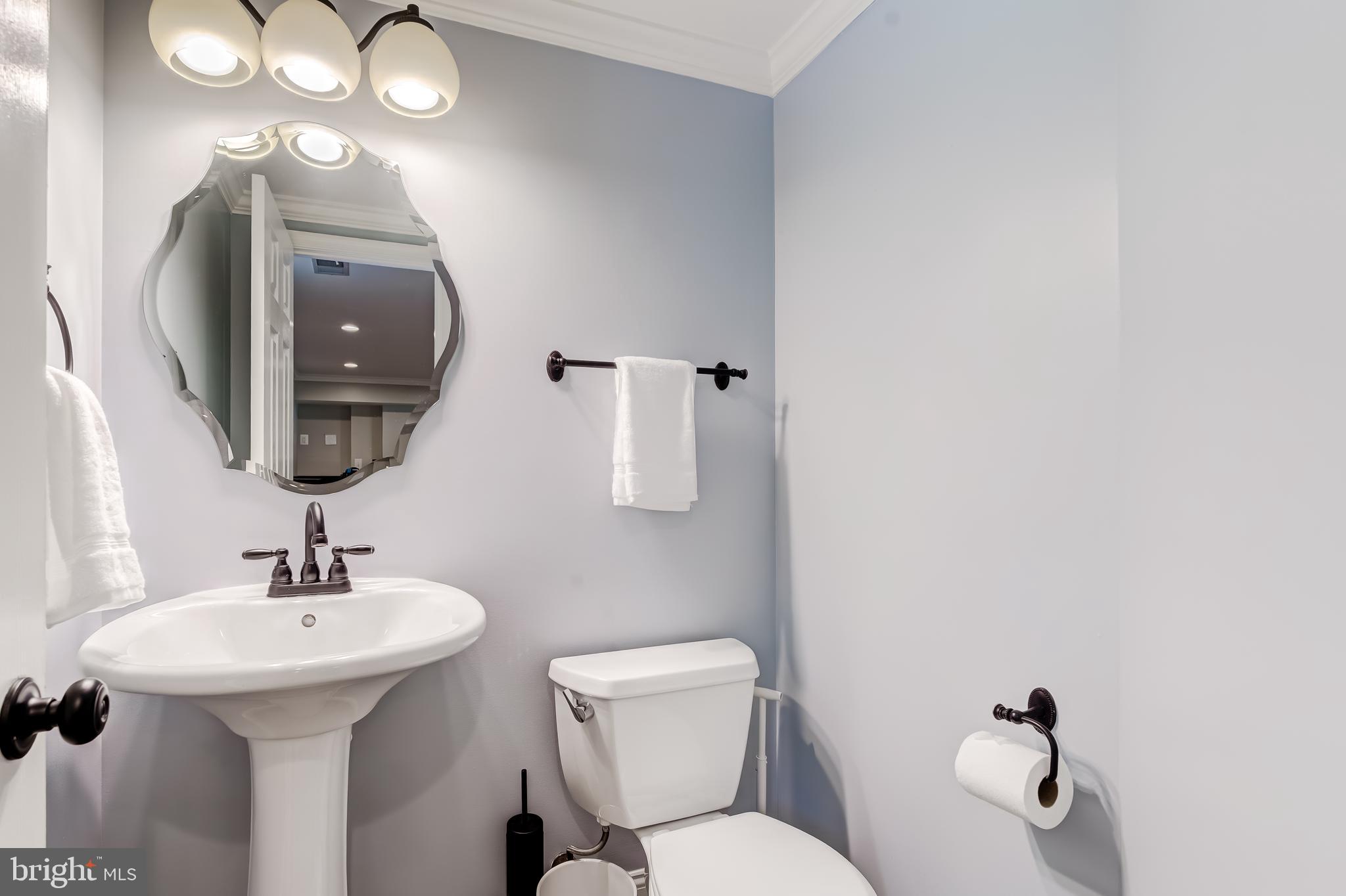 11926 Appling Valley Road Fairfax, VA 22030 - Photo 50 of 60 a bathroom with a toilet sink and mirror