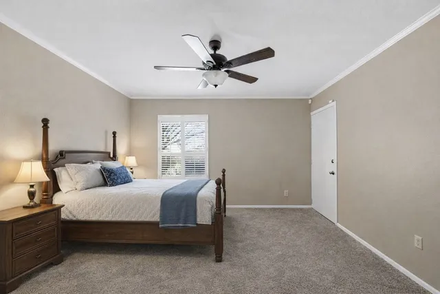 a bedroom with bed and window