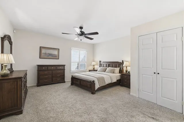 a bed room with a bed and a dresser