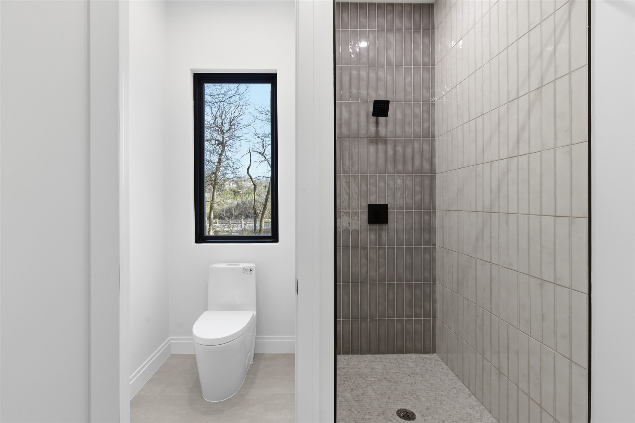 5013 Rob-Scott Street Austin, TX 78721 - Photo 31 of 35 Walk in shower and water close in ensuite bath.