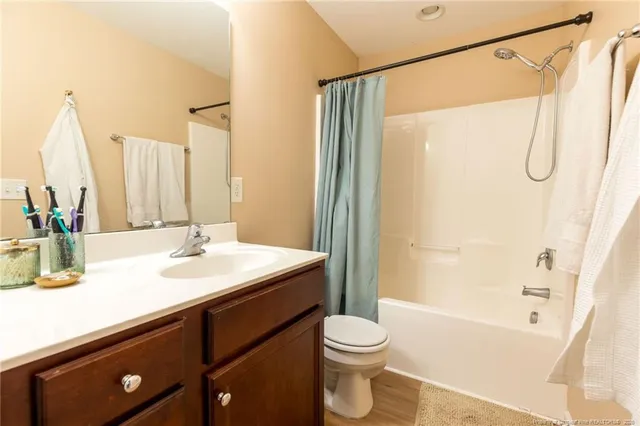 a bed room with a bed and a window