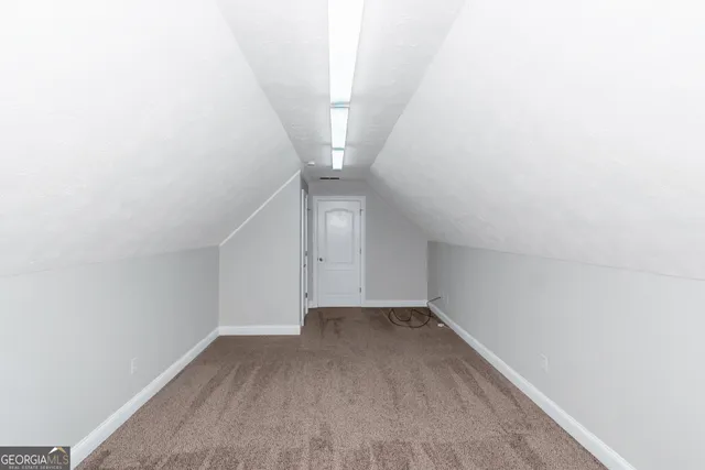 a view of a hallway with stairs