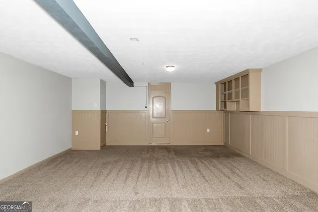 a view of empty room with stairs