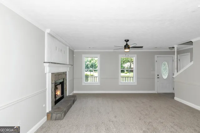 a view of empty room with fireplace