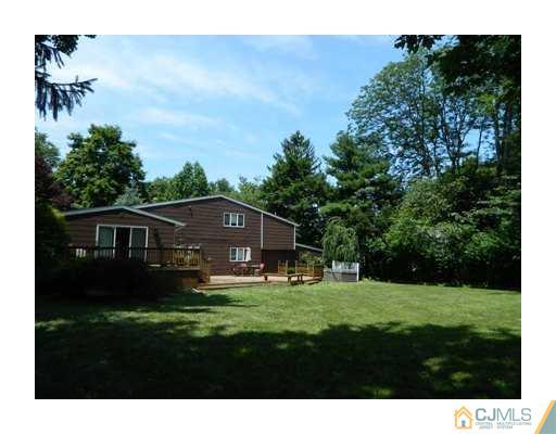 5 Hamlin Road East Brunswick, NJ 08816 - Photo 3 of 16 a front view of a house with garden