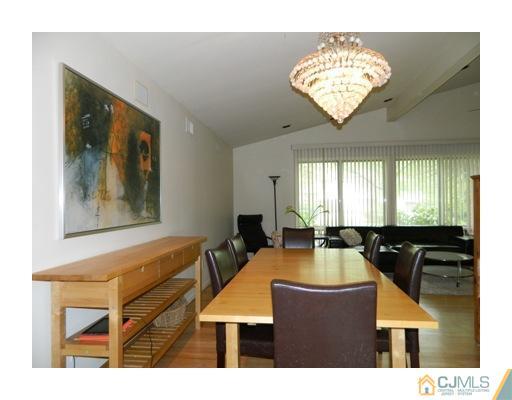 5 Hamlin Road East Brunswick, NJ 08816 - Photo 9 of 16 a view of a dining room with furniture and chandelier