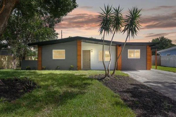 a house with a yard and a large space