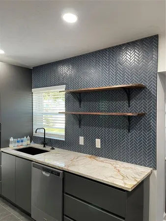 a kitchen with a sink and a window