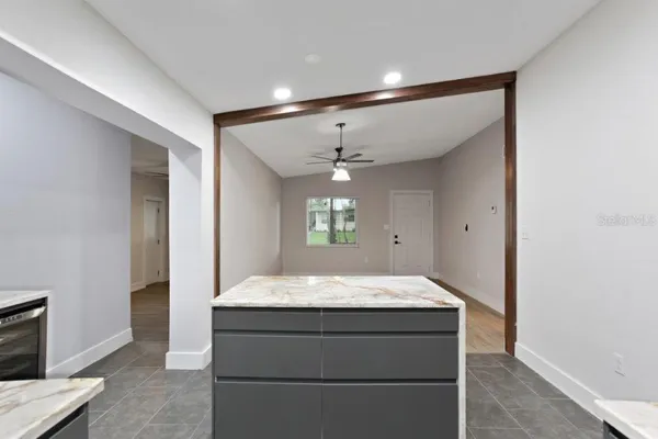 a room with a bed and a dresser