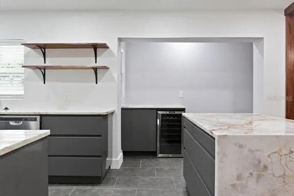a kitchen with a stove and a refrigerator