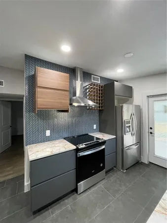 a room with furniture a washer and dryer