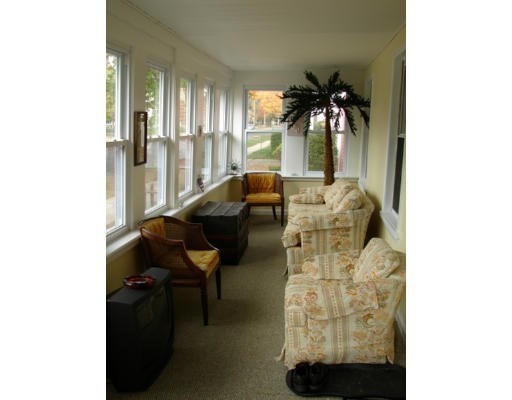 93 Farnsworth Street Springfield, MA 01107 - Photo 2 of 24 a living room with furniture and a potted plant