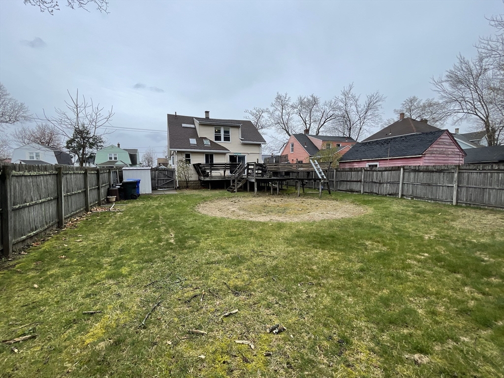 93 Farnsworth Street Springfield, MA 01107 - Photo 24 of 24 a view of a house with a yard and sitting area