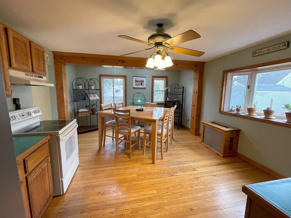93 Farnsworth Street Springfield, MA 01107 - Photo 4 of 24 a view of a dining room with furniture window and wooden floor