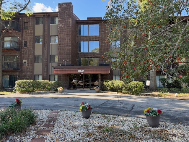 14647 Greenwood Road, Unit 312 Dolton, IL 60419 - Photo 1 of 12 a front view of a building with street view
