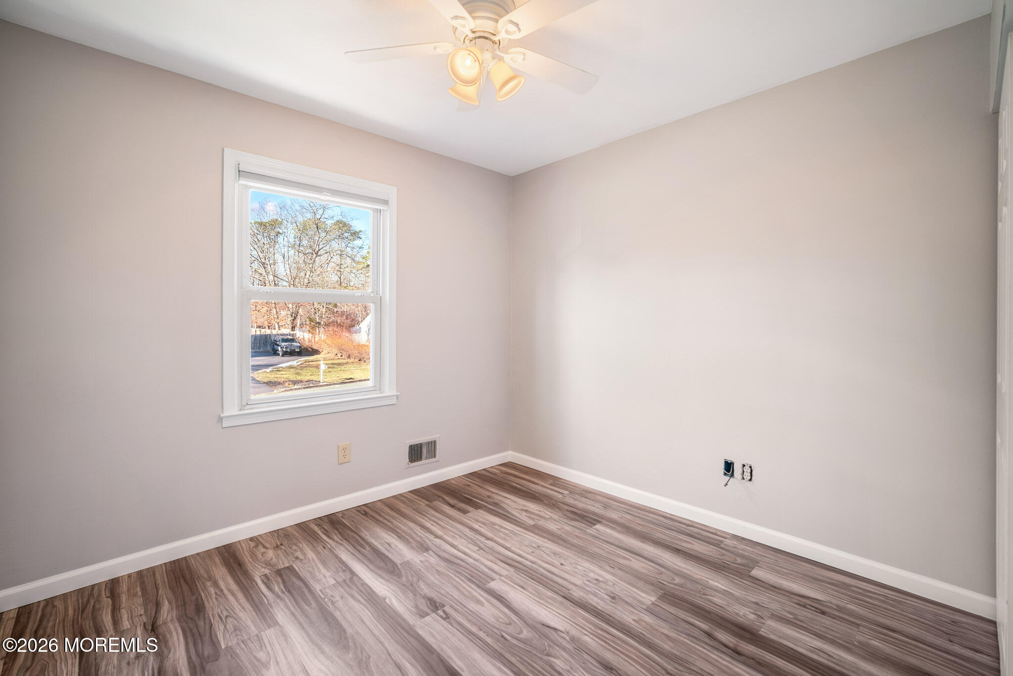 12 6th Street Barnegat, NJ 08005 - Photo 14 of 37 wooden floor in an empty room with a window