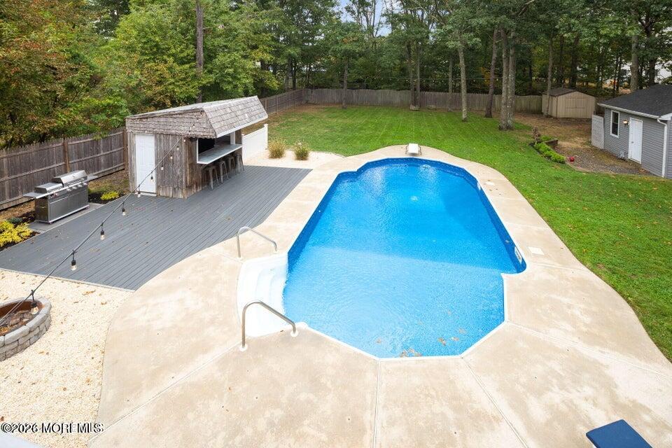 12 6th Street Barnegat, NJ 08005 - Photo 22 of 37 a view of a swimming pool with a yard and sitting area