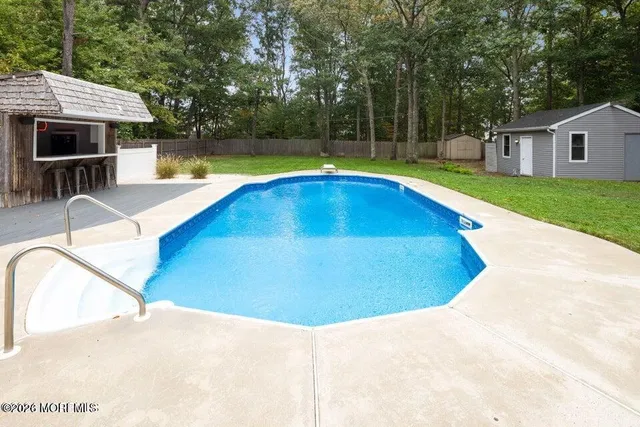 a view of a house with swimming pool
