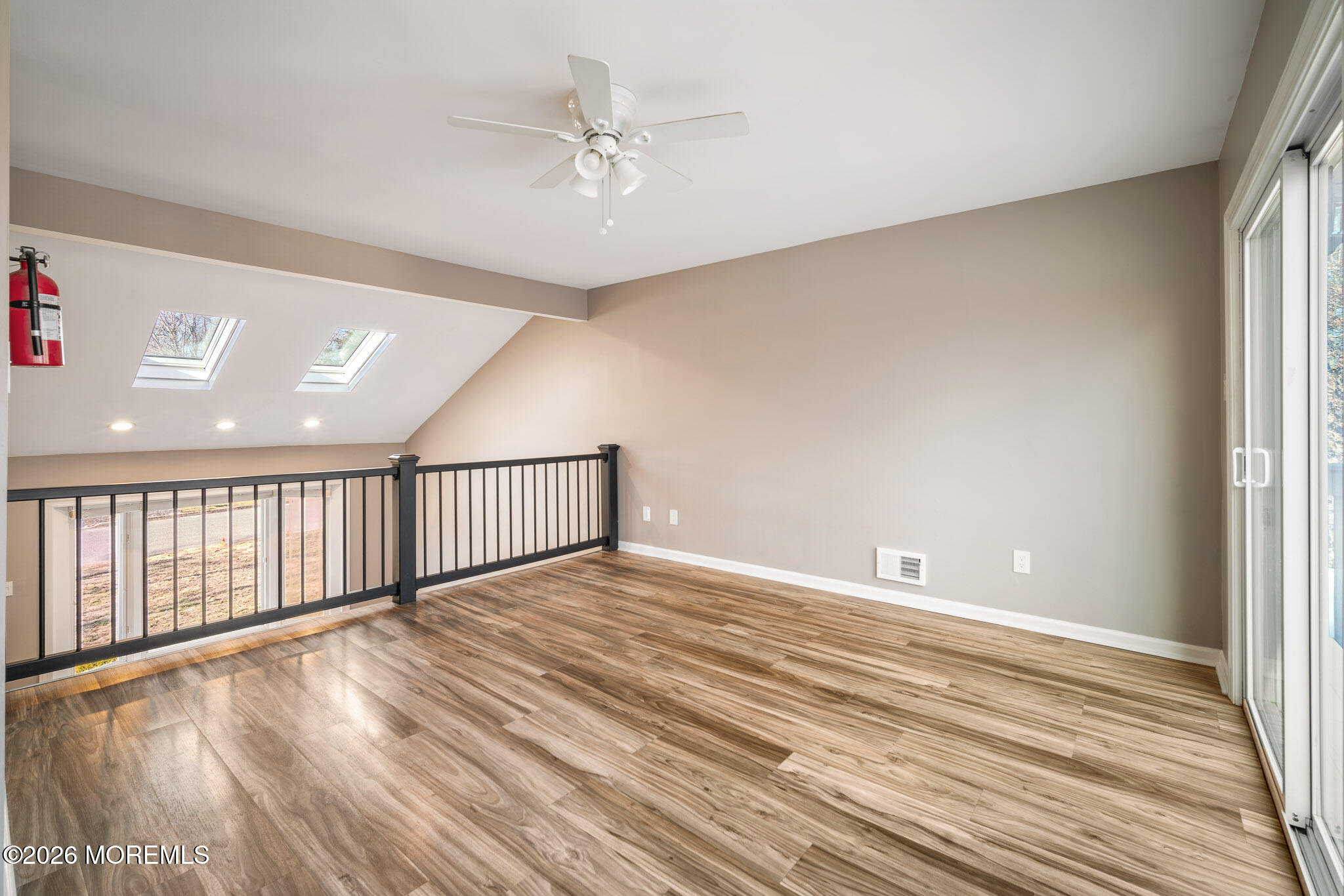 12 6th Street Barnegat, NJ 08005 - Photo 5 of 37 a view of an empty room with wooden floor and a window