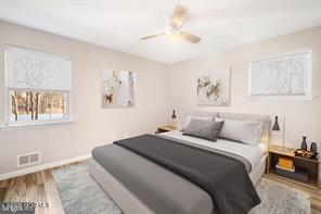 12 6th Street Barnegat, NJ 08005 - Photo 9 of 37 a bedroom with a bed and a painting on the wall