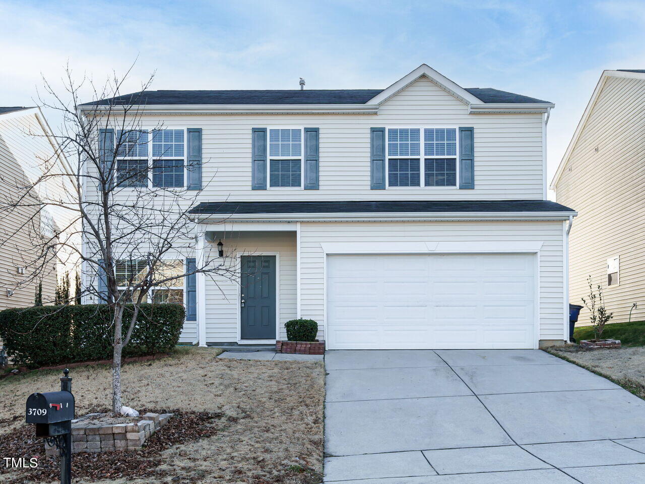 3709 Madeline Way Raleigh, NC 27610 - Photo 1 of 29 a front view of a house with a yard and garage