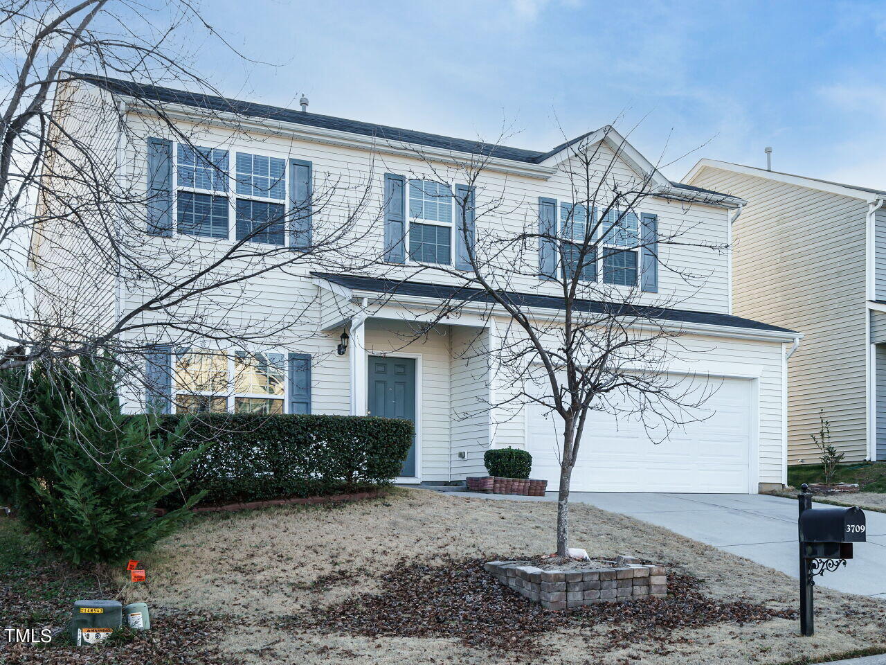 3709 Madeline Way Raleigh, NC 27610 - Photo 2 of 29 a front view of a house with garden