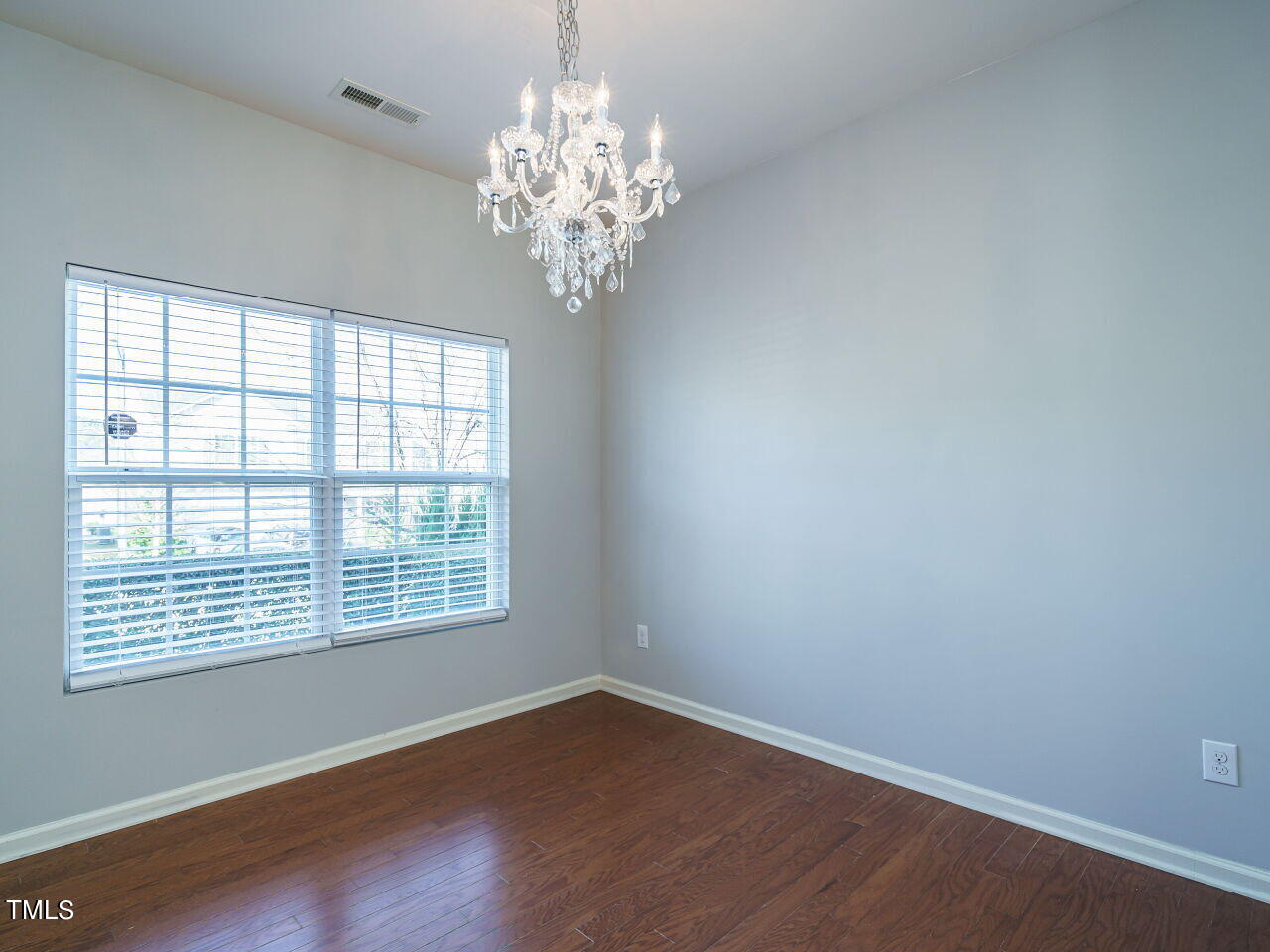 3709 Madeline Way Raleigh, NC 27610 - Photo 5 of 29 a view of a room with windows and chandelier