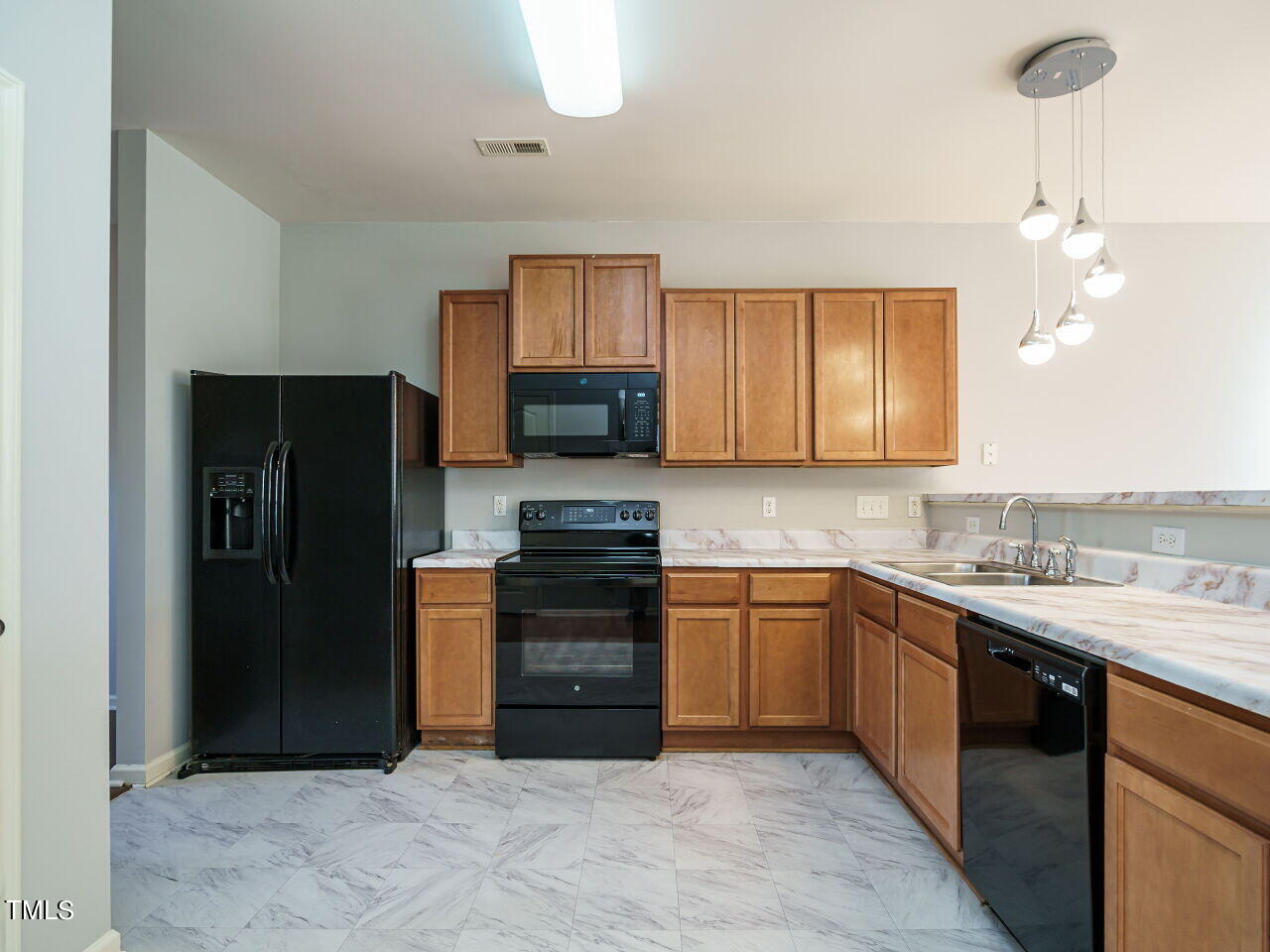 3709 Madeline Way Raleigh, NC 27610 - Photo 8 of 29 a kitchen with stainless steel appliances granite countertop a refrigerator a sink a stove and dishwasher