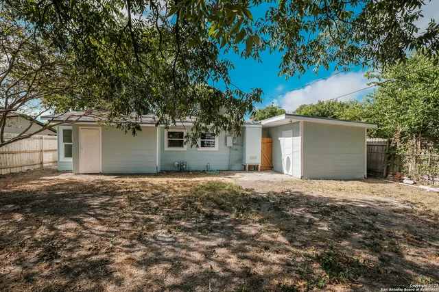 front view of house with a trees