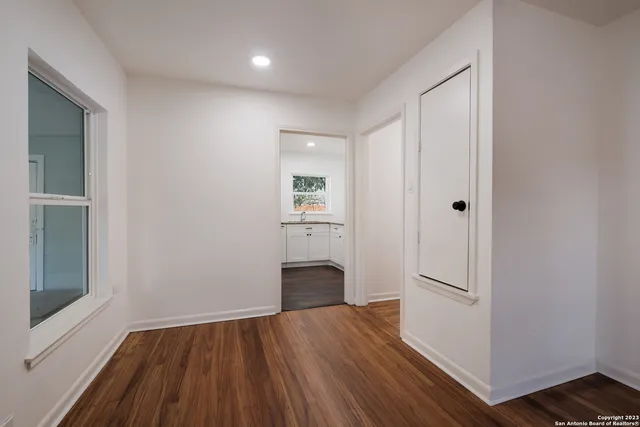 a view of wooden floor in an empty room