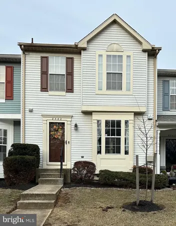 a front view of a house with a garage