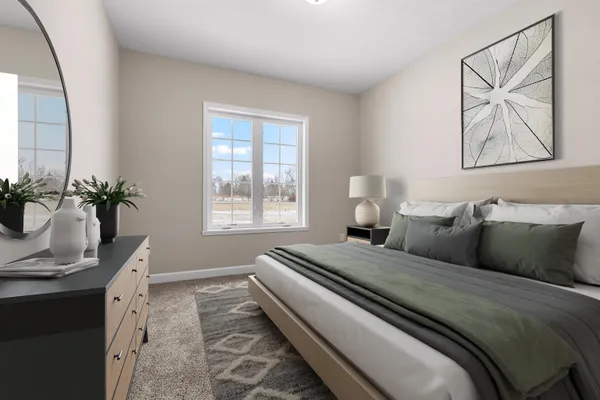 a bedroom with bed and window
