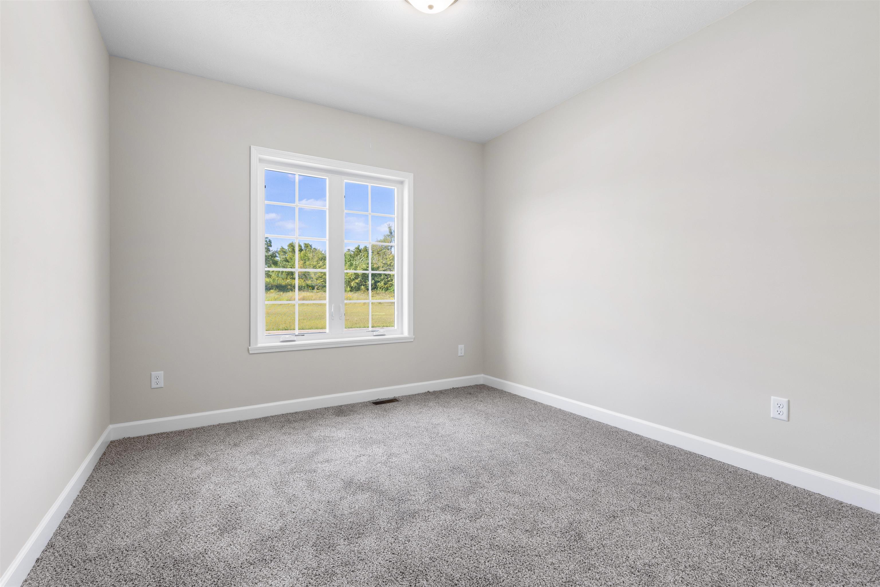 7743 Cherry Hill Road Cherry Valley, IL 61016 - Photo 12 of 18 a view of an empty room with a window
