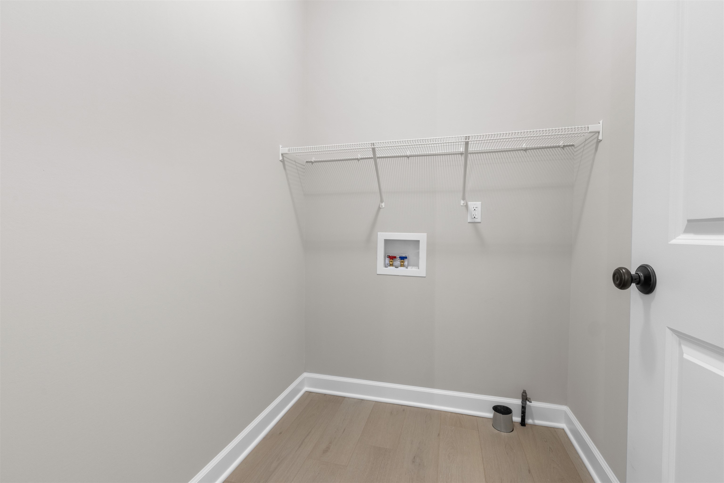 7743 Cherry Hill Road Cherry Valley, IL 61016 - Photo 8 of 18 a view of a room with racks on the wall