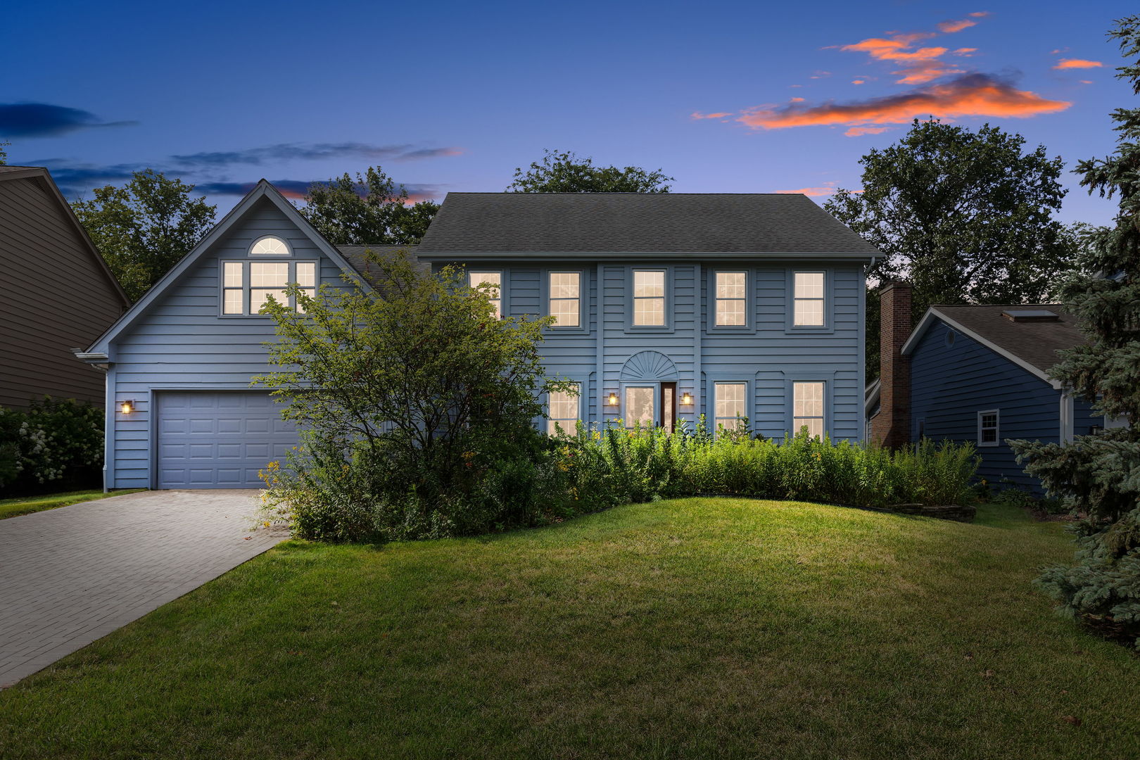 2647 Sun Valley Road Lisle, IL 60532 - Photo 1 of 26 a view of a brick house with a yard