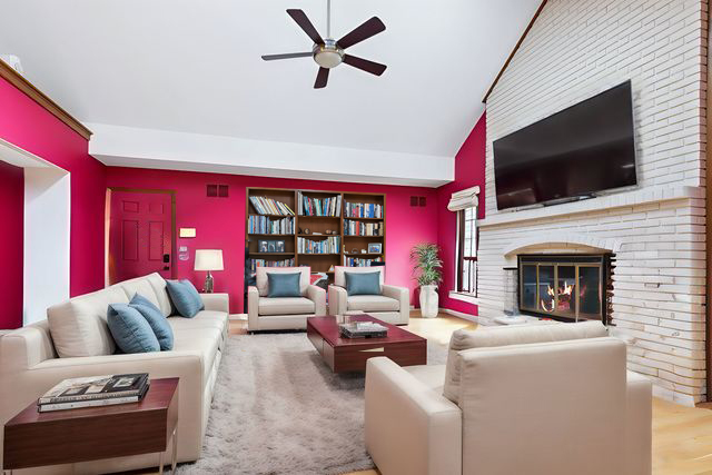 2647 Sun Valley Road Lisle, IL 60532 - Photo 11 of 26 a living room with furniture a flat screen tv and a fireplace