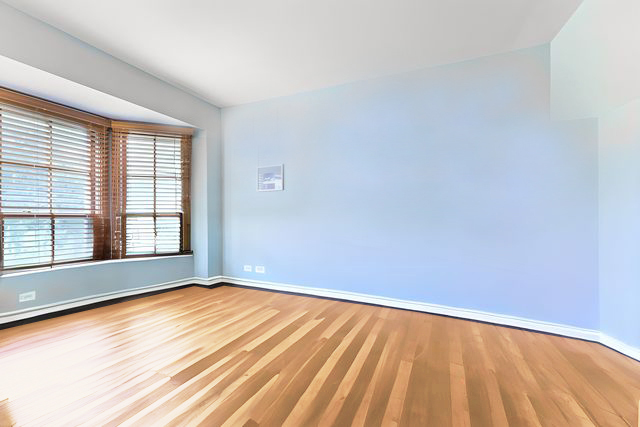 2647 Sun Valley Road Lisle, IL 60532 - Photo 13 of 26 a view of an empty room with a window and wooden floor